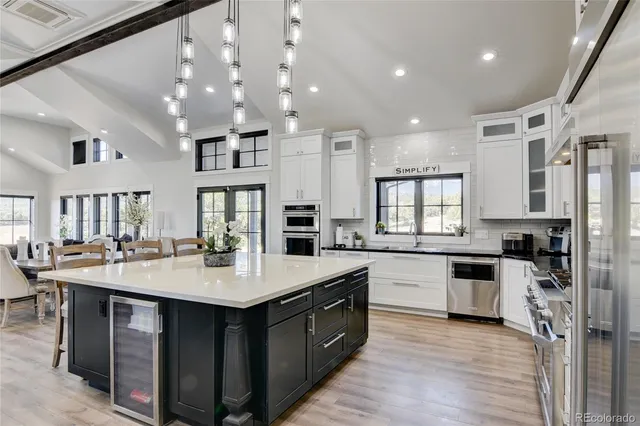 a large kitchen with lots of counter space sink and appliances