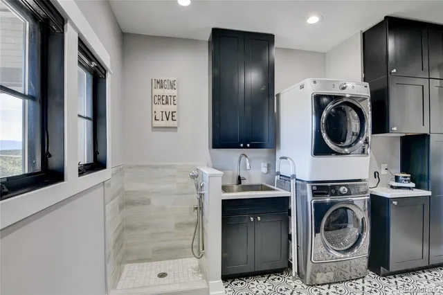 a view of a kitchen with washer and dryer