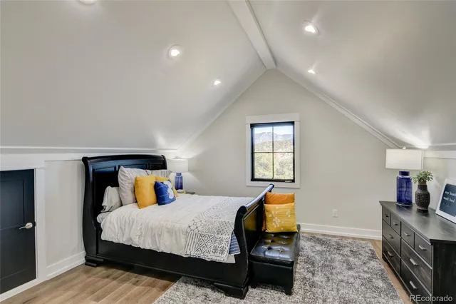 a bedroom with bed and window