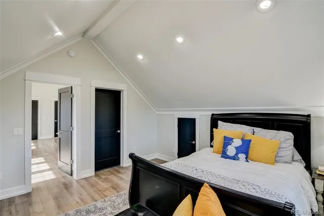 a bedroom with a bed and a dresser