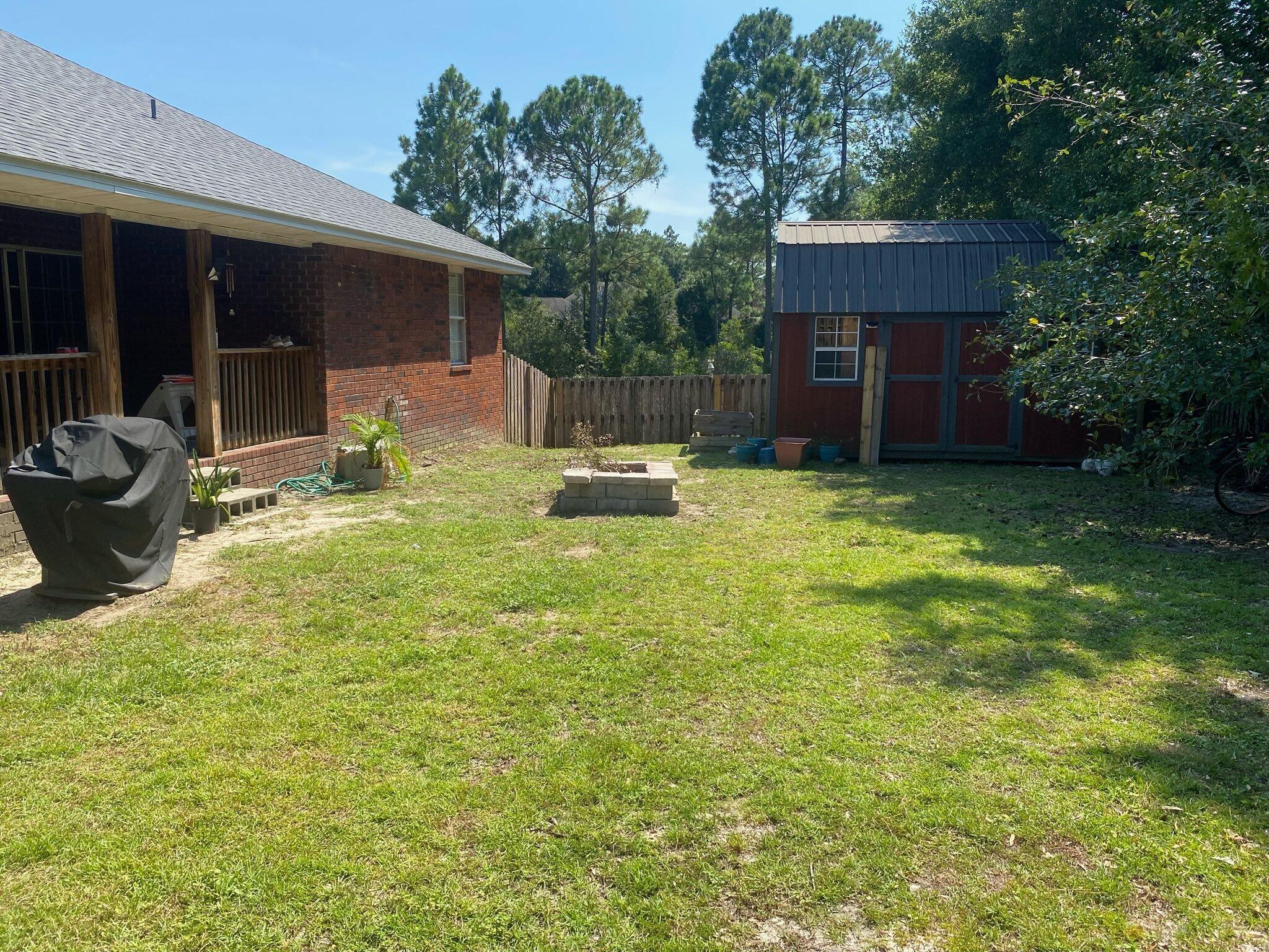 421 Swift Fox Run Crestview, FL 32536 - Photo 12 of 35 Backyard and View to Shed