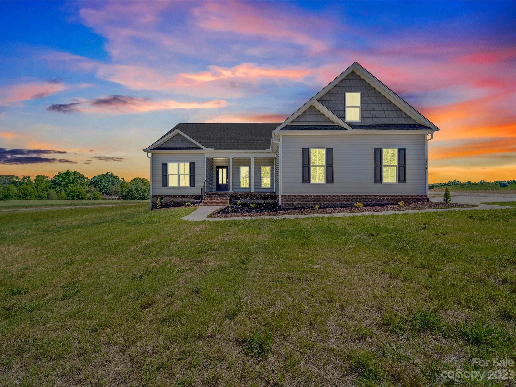 1321 Stack Road Monroe, NC 28112 - Photo 1 of 33 a front view of a house with garden