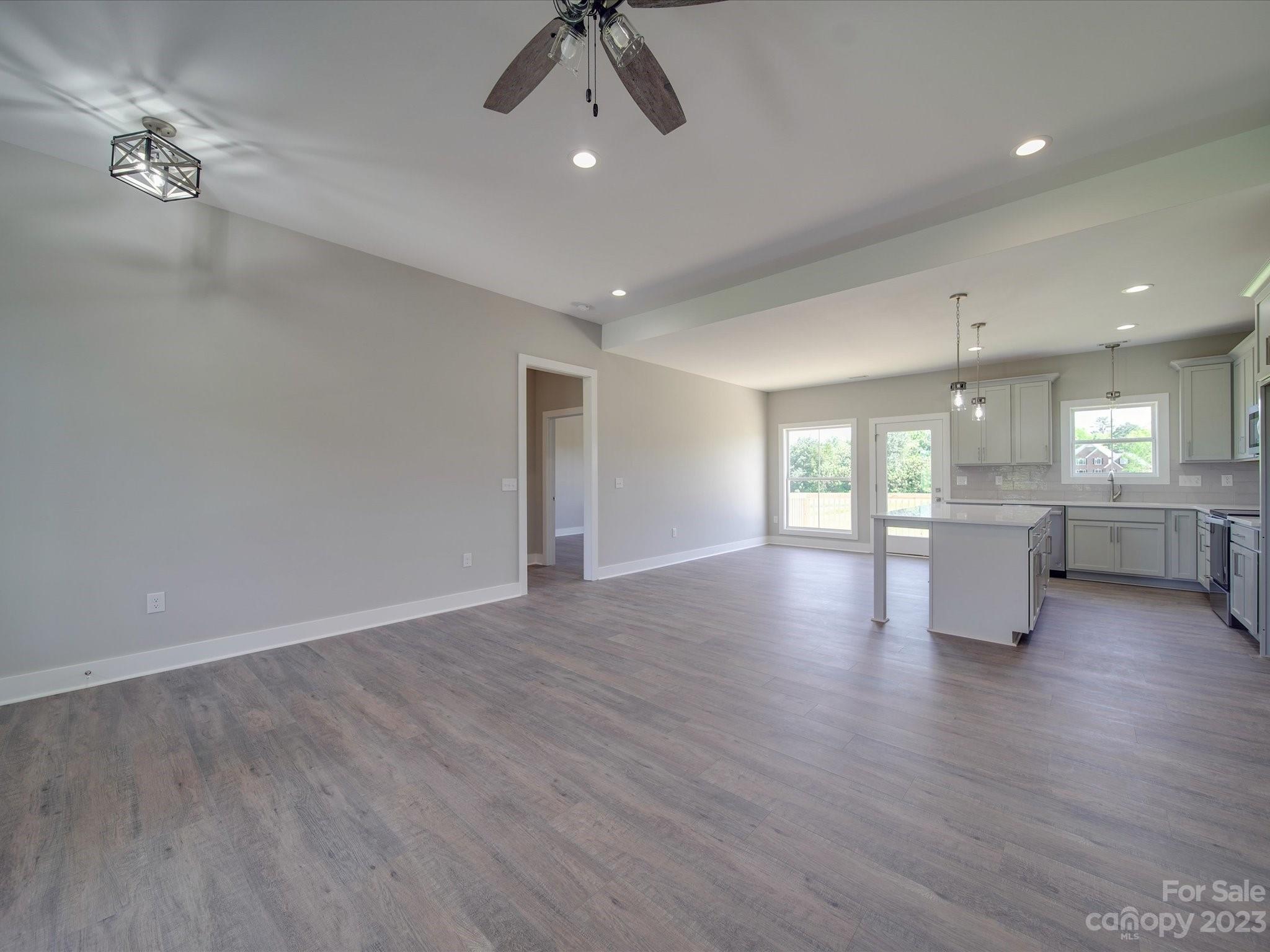 1321 Stack Road Monroe, NC 28112 - Photo 14 of 33 a view of an empty room with a window and wooden floor