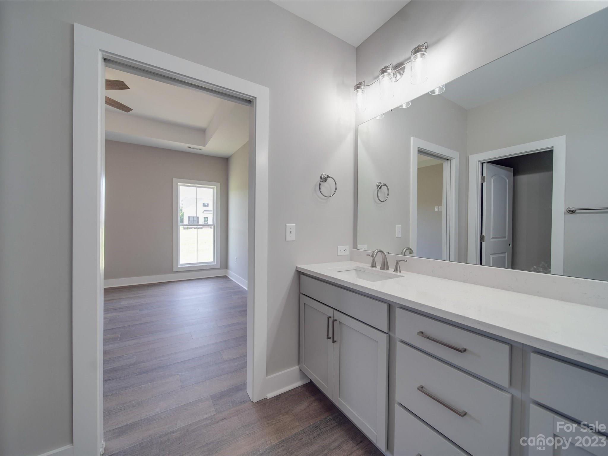 1321 Stack Road Monroe, NC 28112 - Photo 15 of 33 a bathroom with a double vanity sink and a mirror
