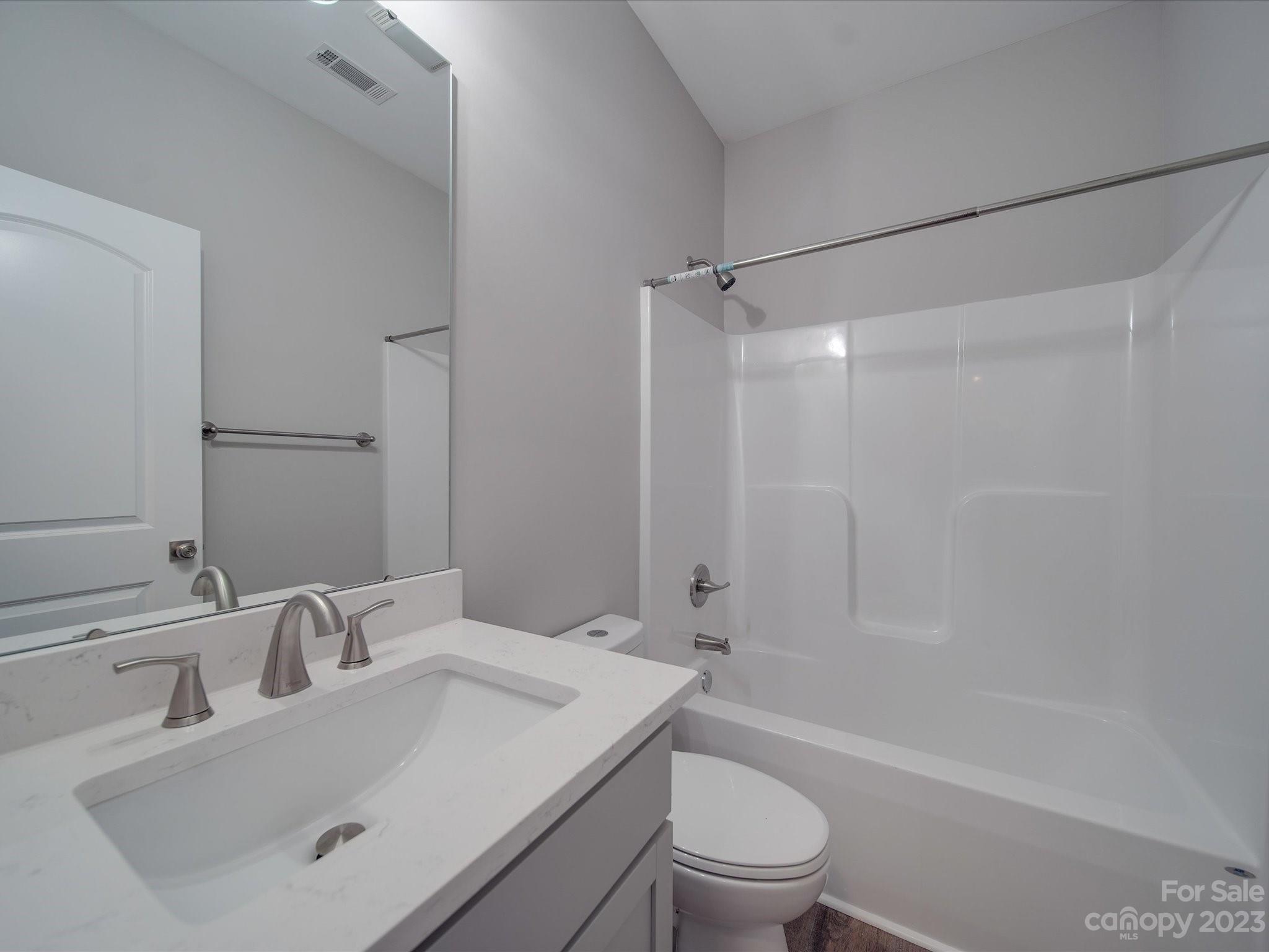 1321 Stack Road Monroe, NC 28112 - Photo 19 of 33 a bathroom with a sink a toilet and shower