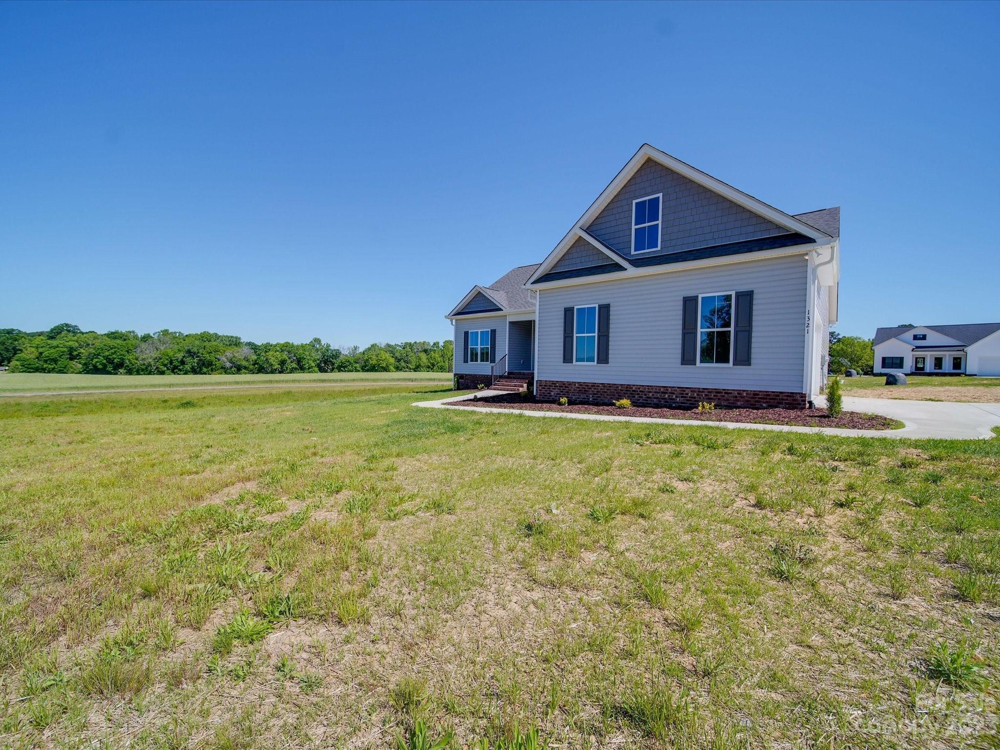 1321 Stack Road Monroe, NC 28112 - Photo 2 of 33 a front view of a house with garden