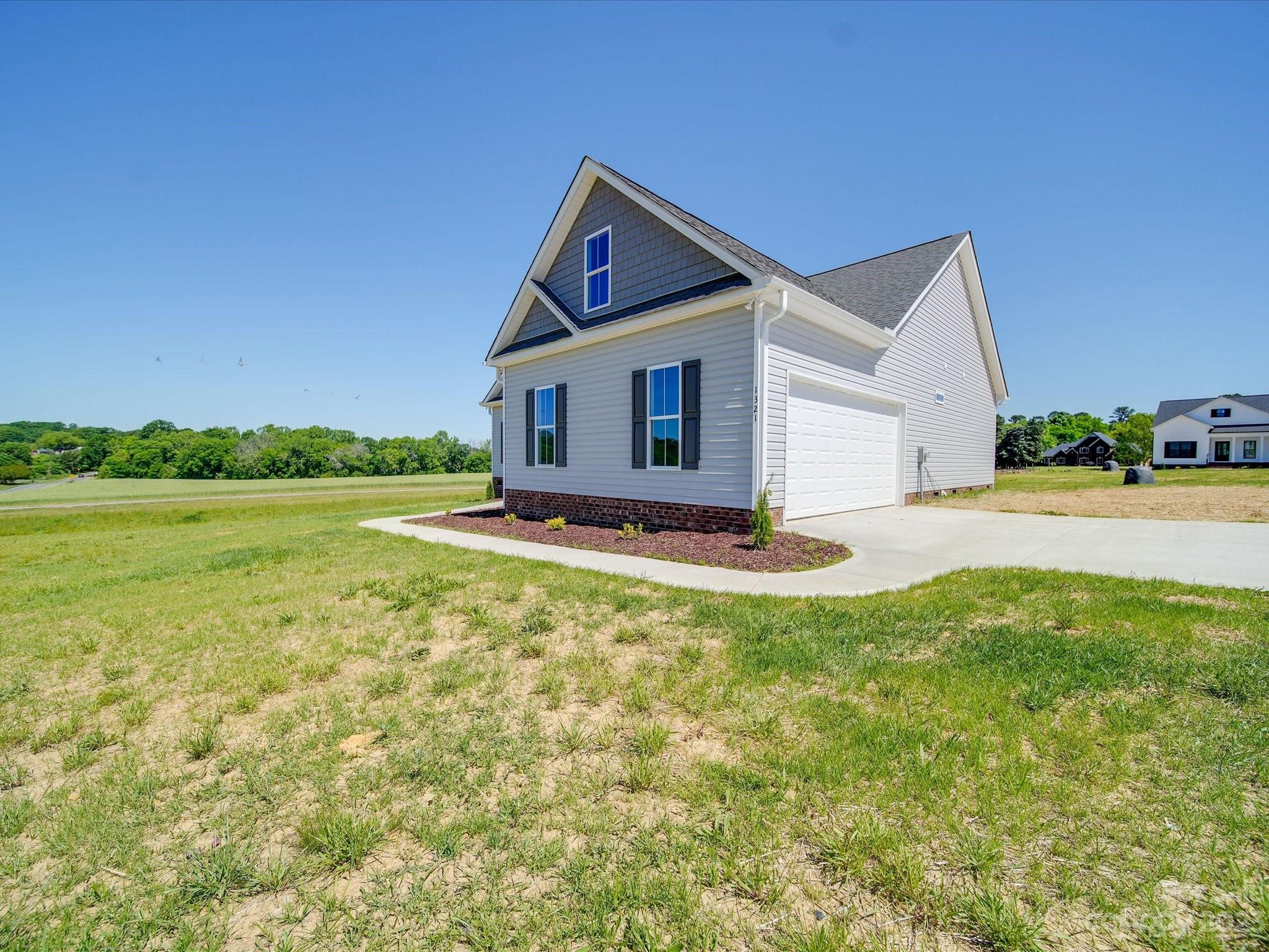 1321 Stack Road Monroe, NC 28112 - Photo 28 of 33 a front view of house with yard and green space