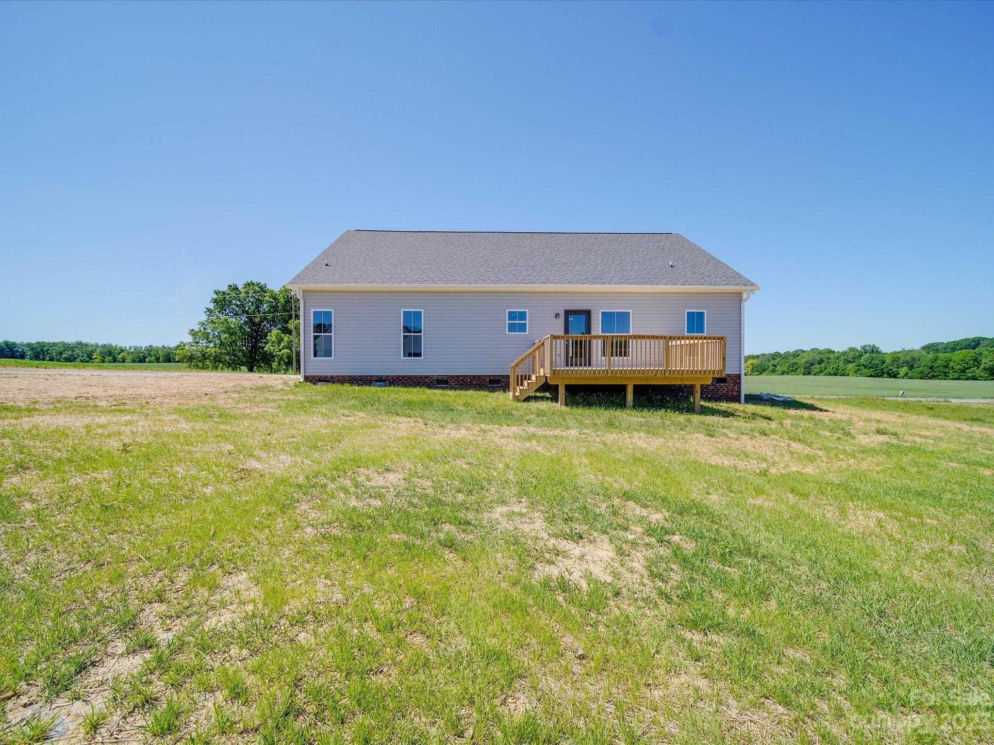 1321 Stack Road Monroe, NC 28112 - Photo 30 of 33 a view of a house with a big yard and large trees