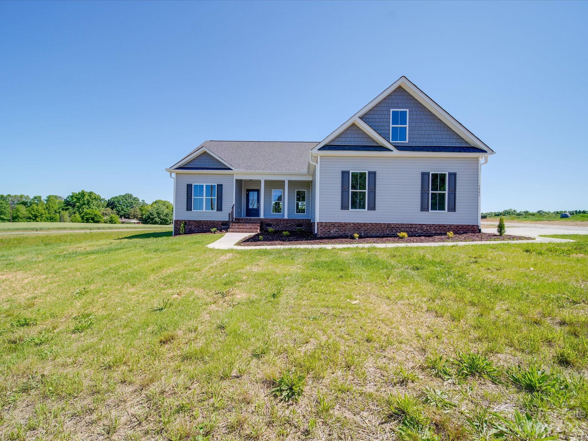 1321 Stack Road Monroe, NC 28112 - Photo 3 of 33 a front view of a house with garden