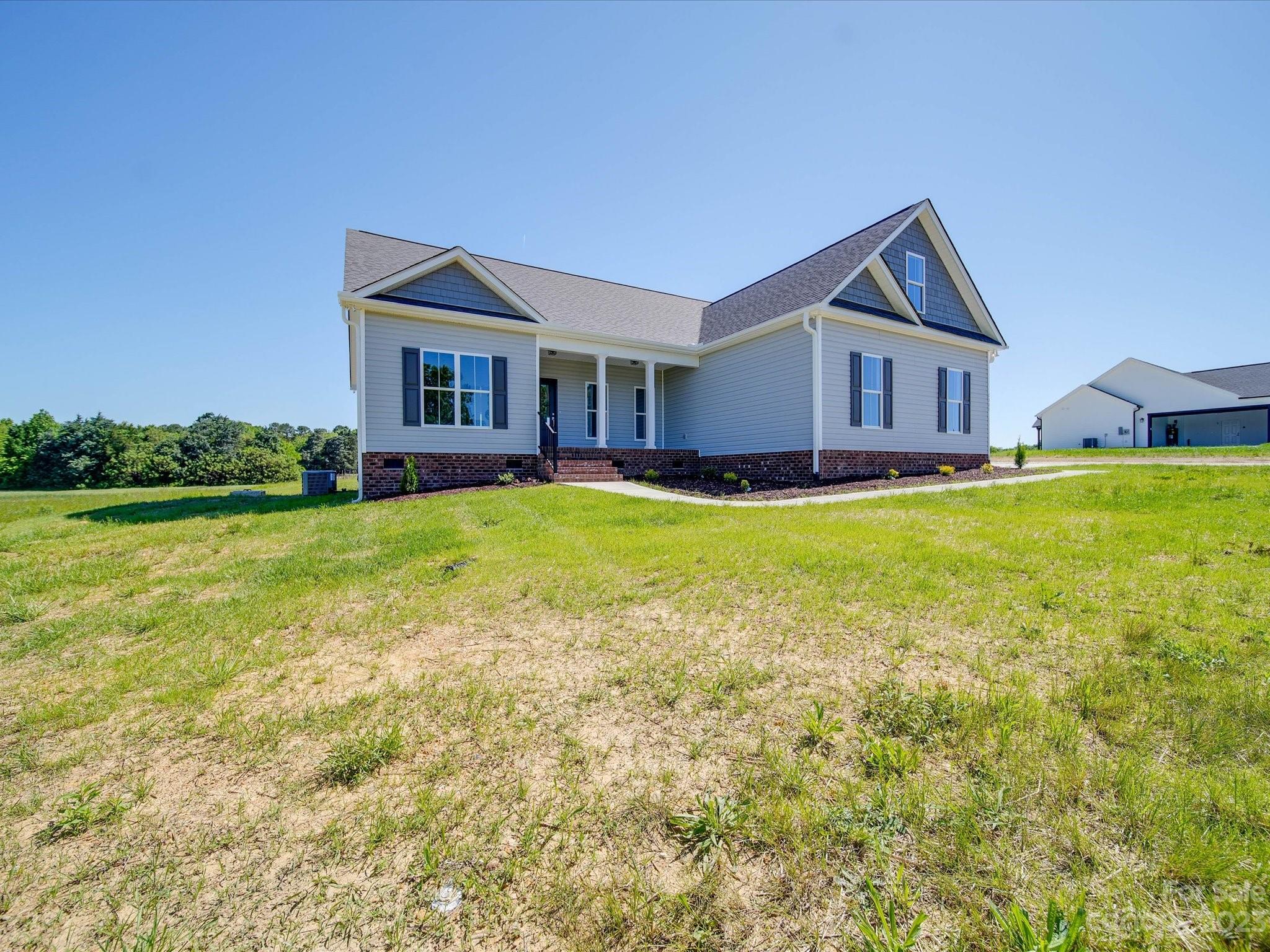 1321 Stack Road Monroe, NC 28112 - Photo 32 of 33 a front view of a house with a yard