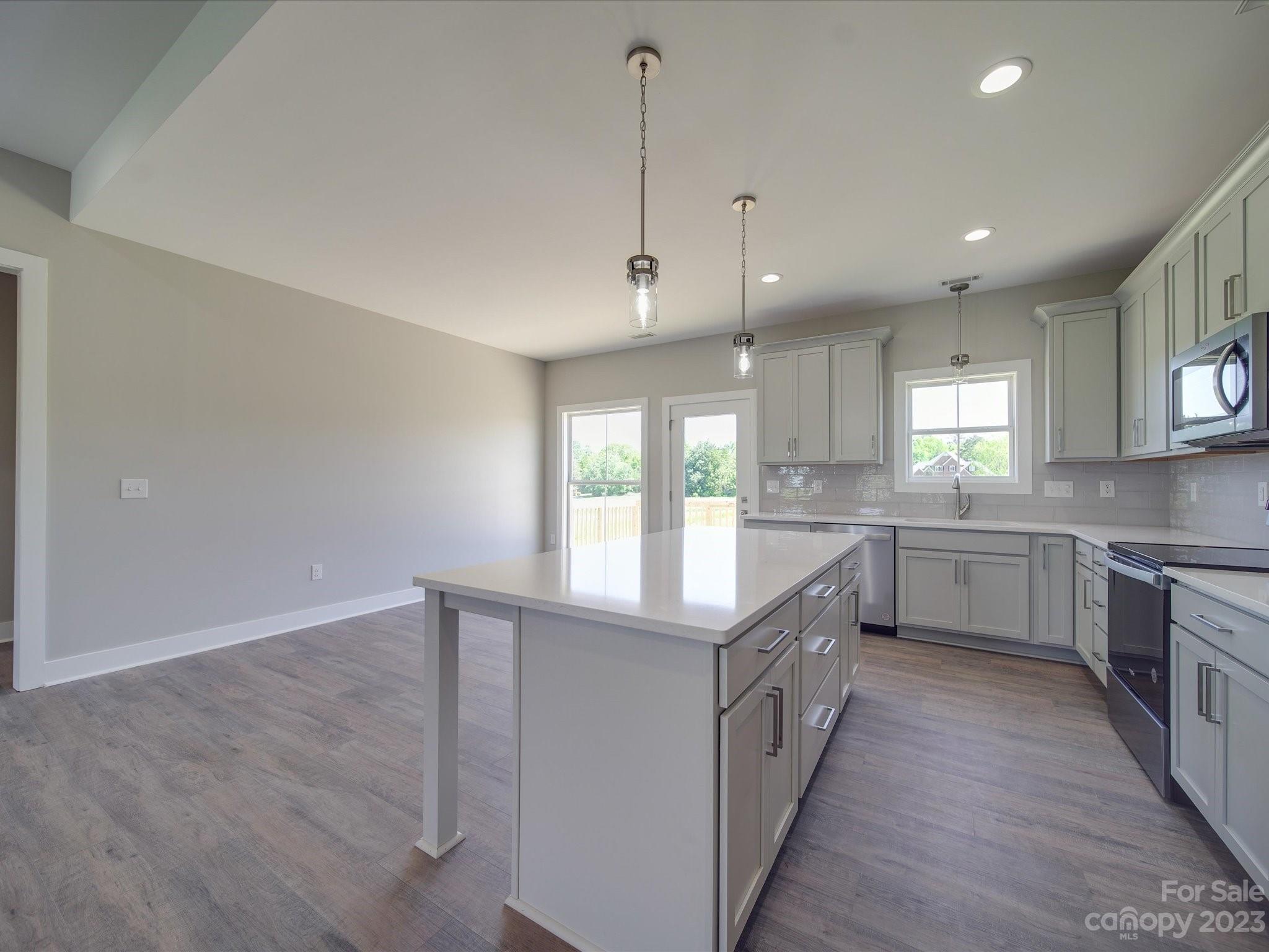 1321 Stack Road Monroe, NC 28112 - Photo 6 of 33 a kitchen with counter top space and wooden floor