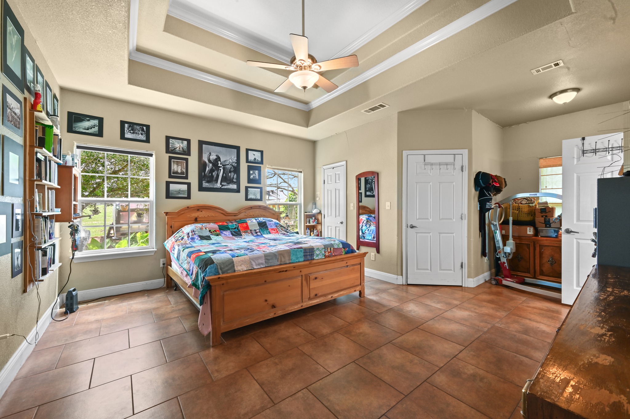 410 Simmons Family Farm Road Lockhart, TX 78644 - Photo 16 of 40 a bedroom with furniture and large window
