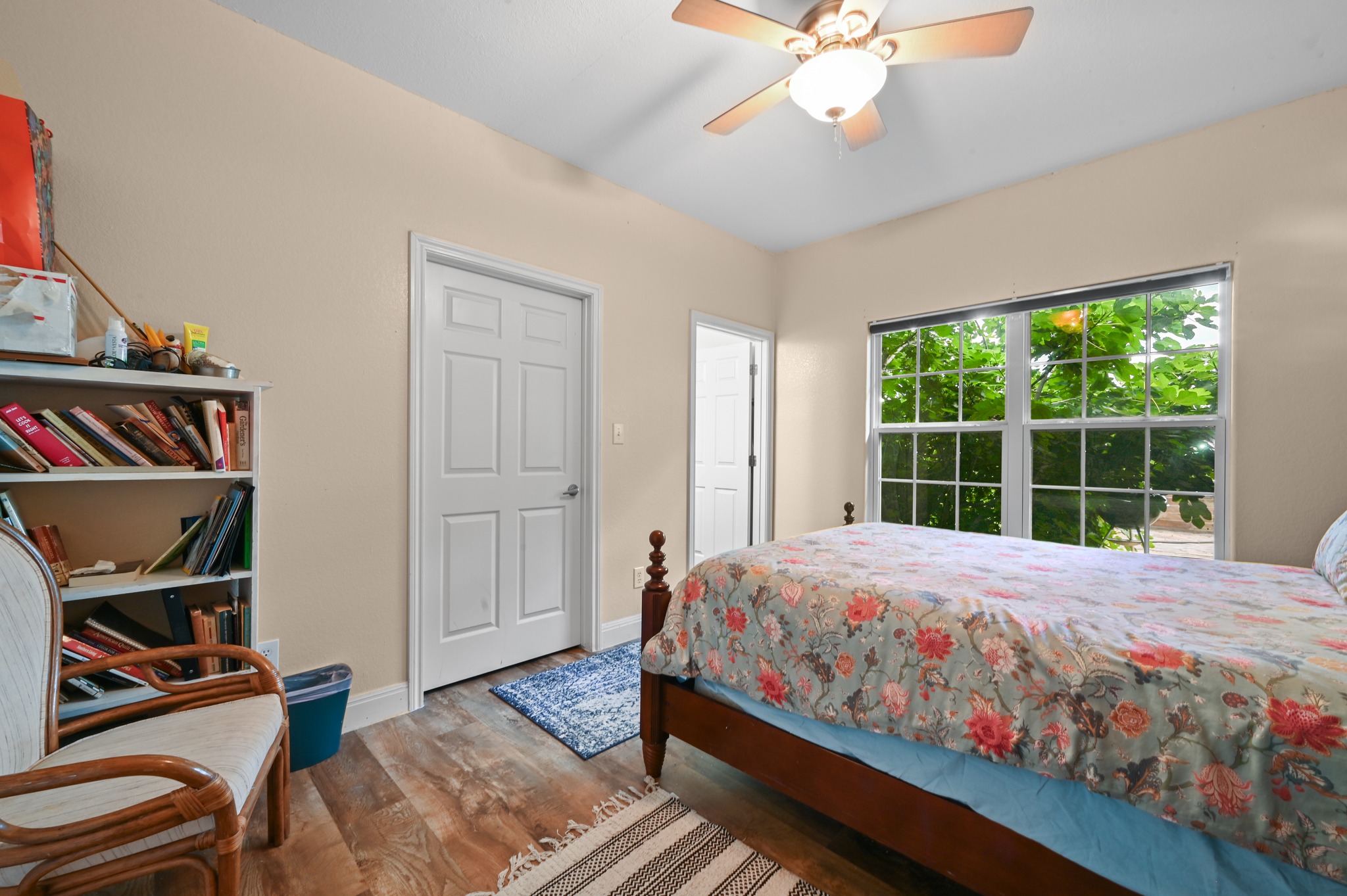 410 Simmons Family Farm Road Lockhart, TX 78644 - Photo 21 of 40 a bedroom with a bed cabinets and a window