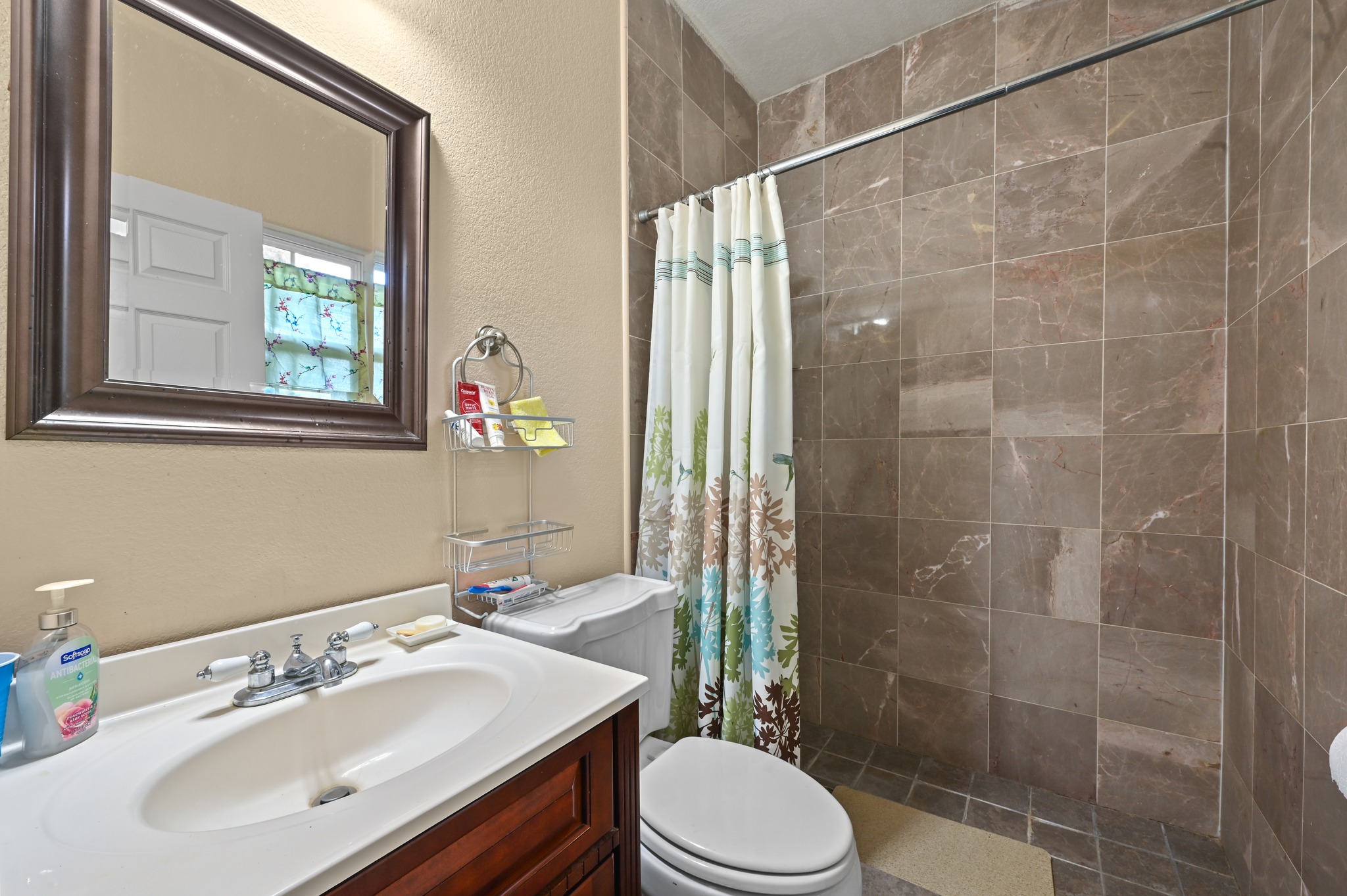 410 Simmons Family Farm Road Lockhart, TX 78644 - Photo 22 of 40 a bathroom with a sink toilet and shower