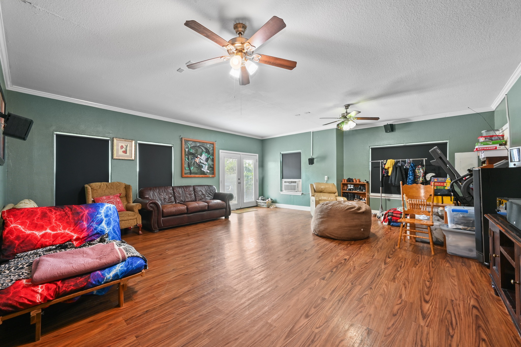 410 Simmons Family Farm Road Lockhart, TX 78644 - Photo 23 of 40 a living room with furniture and wooden floor
