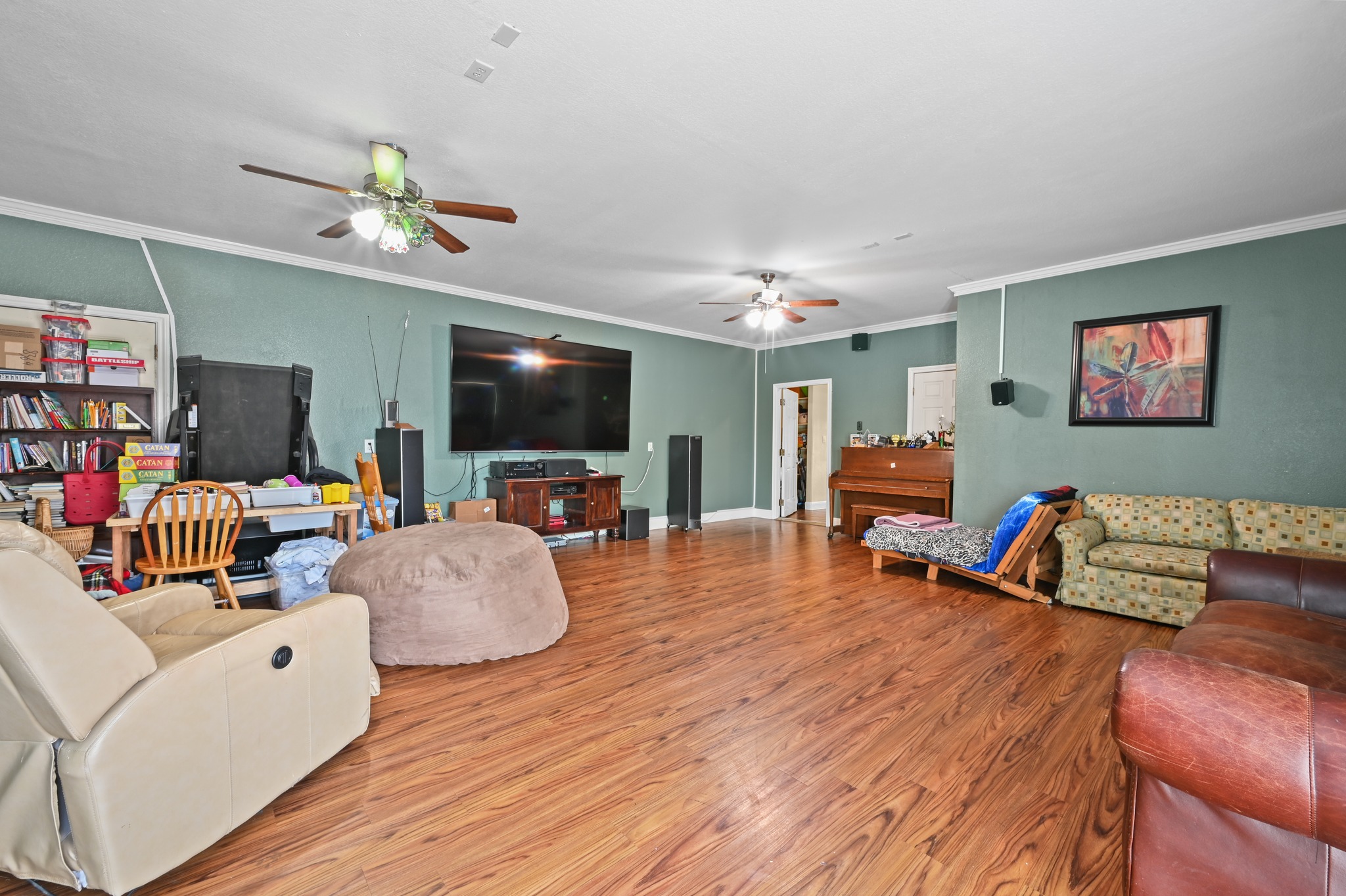 410 Simmons Family Farm Road Lockhart, TX 78644 - Photo 24 of 40 a living room with furniture and a flat screen tv