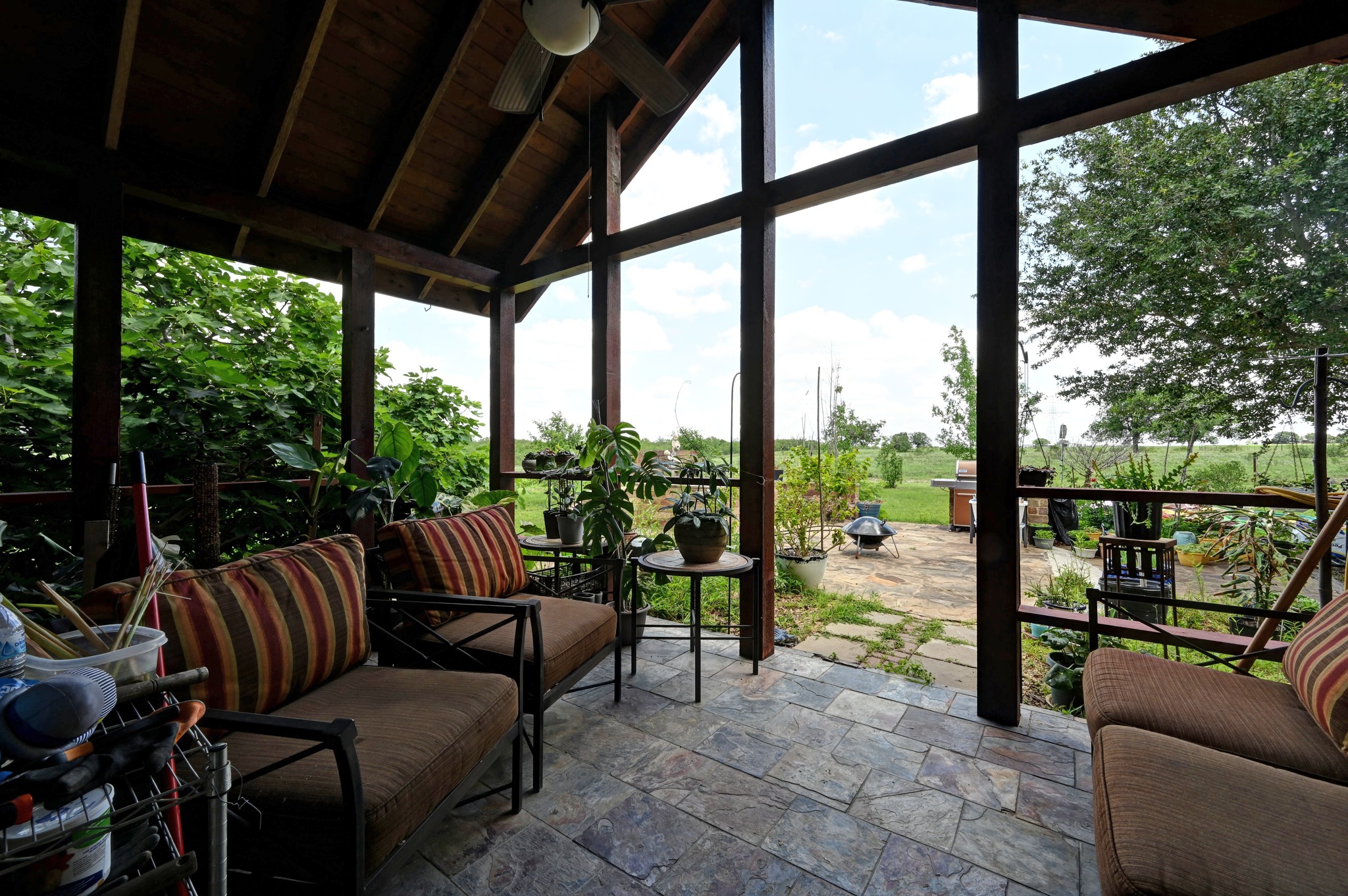 410 Simmons Family Farm Road Lockhart, TX 78644 - Photo 25 of 40 a balcony with furniture and a floor to ceiling window
