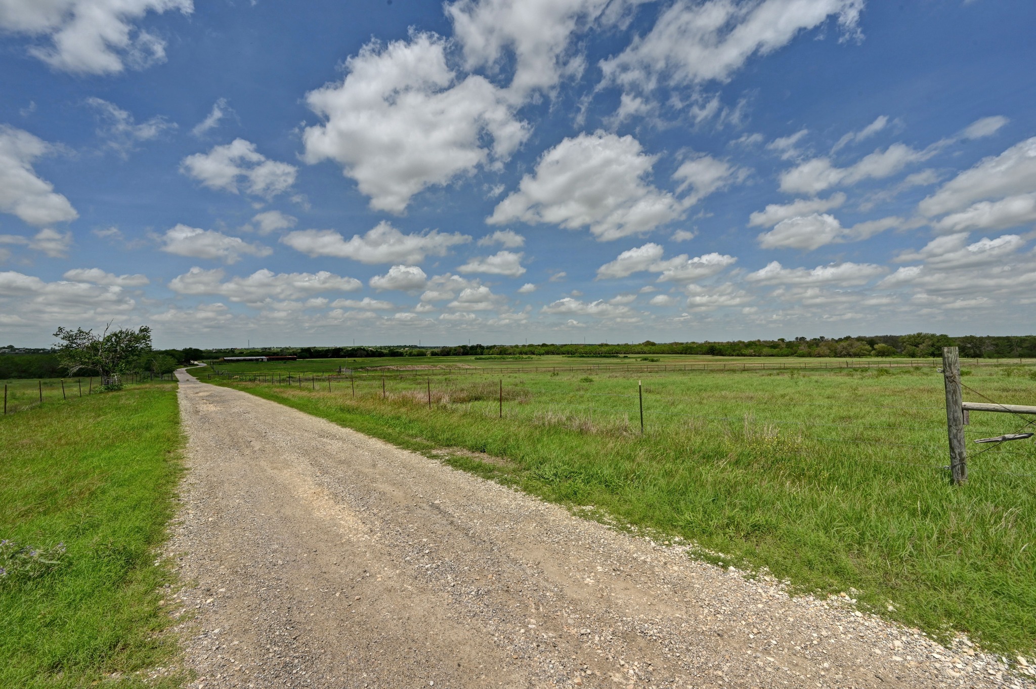 410 Simmons Family Farm Road Lockhart, TX 78644 - Photo 34 of 40 a view of a lake with a big yard