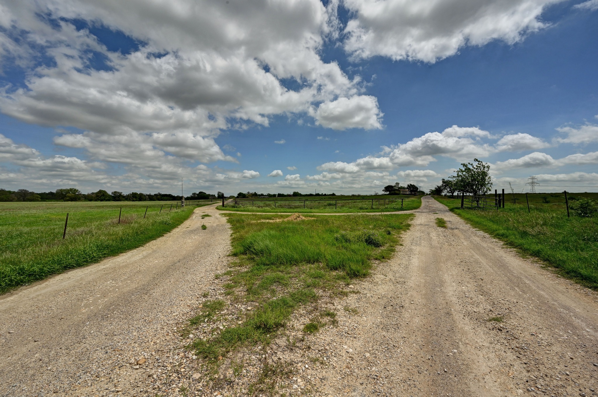 410 Simmons Family Farm Road Lockhart, TX 78644 - Photo 36 of 40 a view of a lake with houses in the back