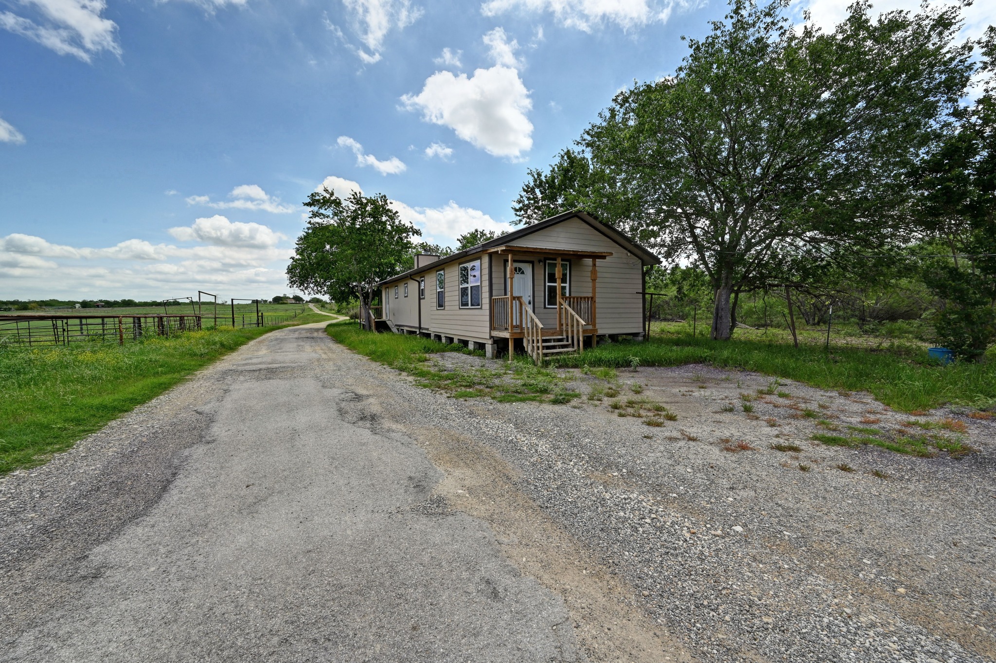 410 Simmons Family Farm Road Lockhart, TX 78644 - Photo 40 of 40 a view of a house with a yard