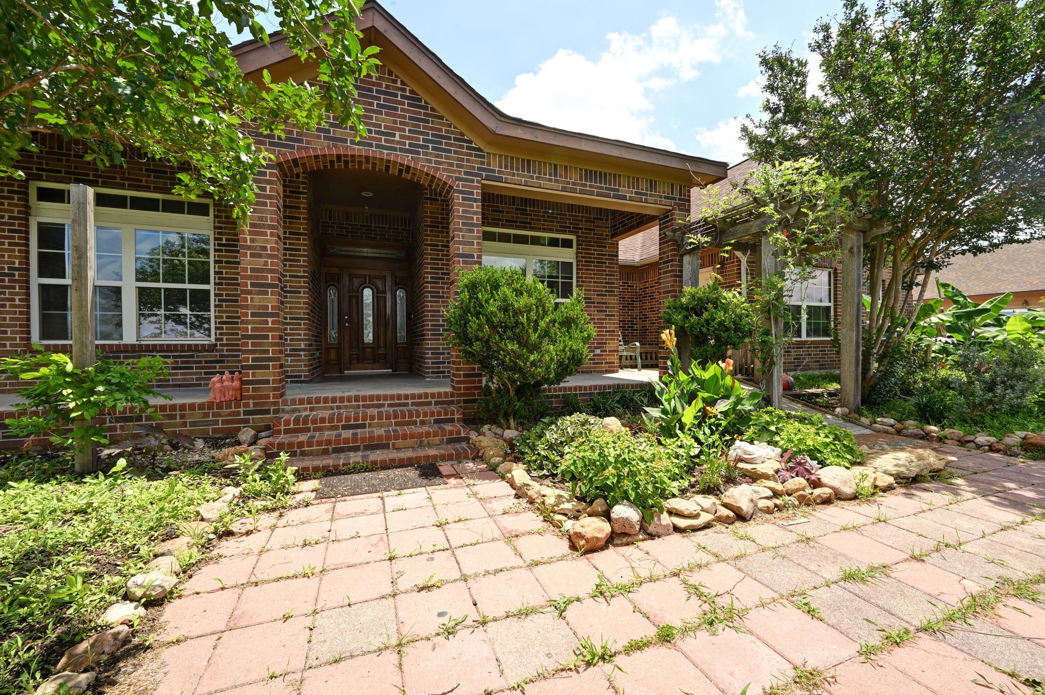 410 Simmons Family Farm Road Lockhart, TX 78644 - Photo 4 of 40 a front view of a house with garden