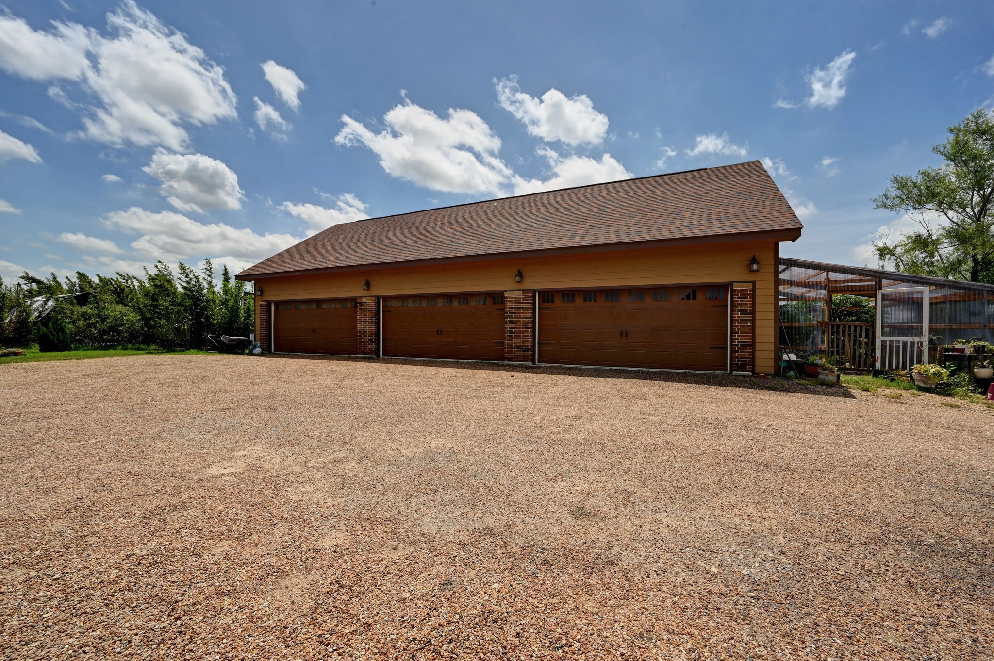 410 Simmons Family Farm Road Lockhart, TX 78644 - Photo 6 of 40 a front view of a house with a yard and garage
