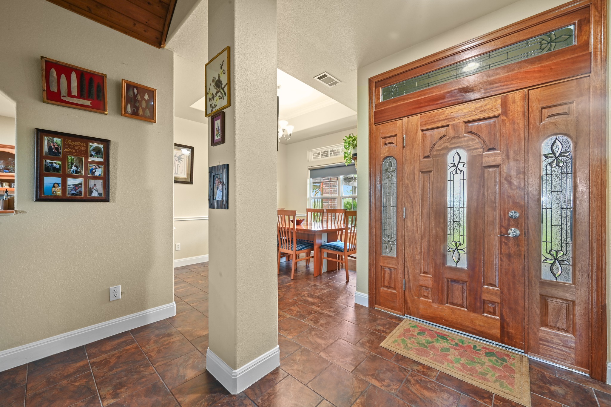 410 Simmons Family Farm Road Lockhart, TX 78644 - Photo 8 of 40 a view of a hallway with dining area and glass door