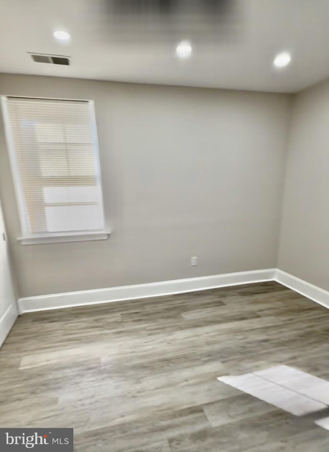 42 Conshohocken State Road, Unit 8A Bala Cynwyd, PA 19004 - Photo 11 of 15 a view of an empty room with wooden floor and a window