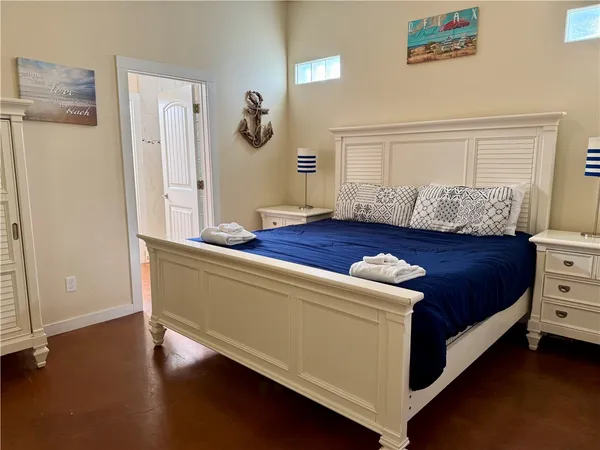 a living room with a bed and a window