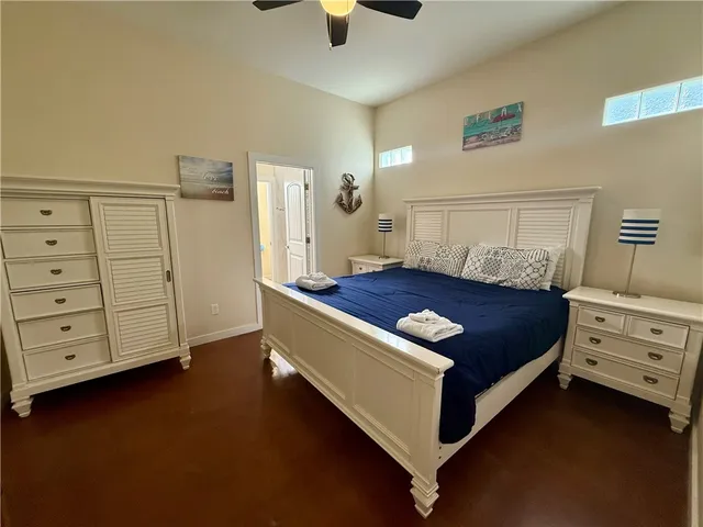 a bedroom with a bed and cabinets