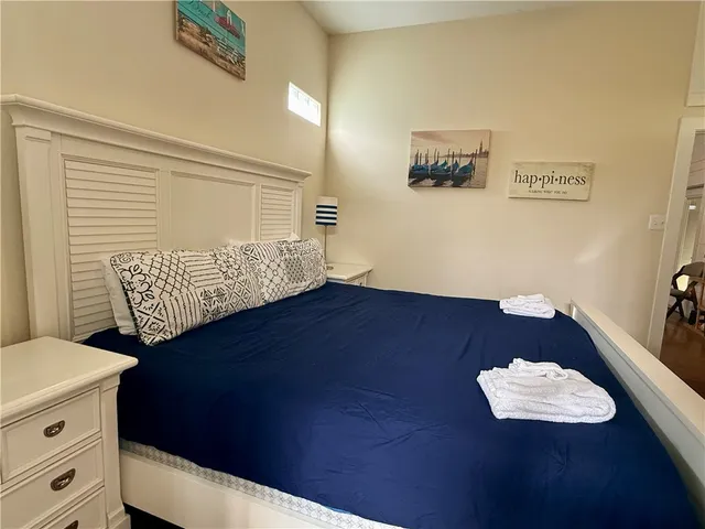 a view of room with cabinets and wooden floor