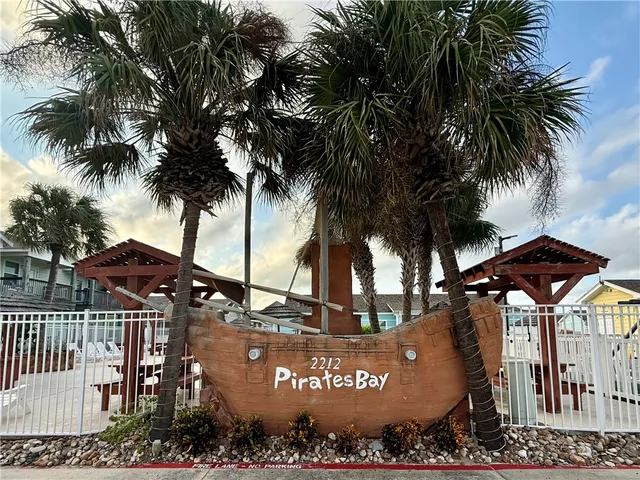 a view of a street with a tree