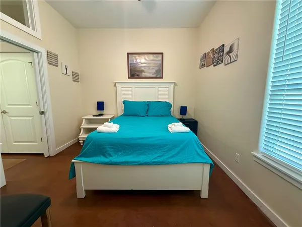 a room with a bed and a window