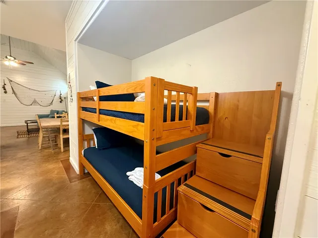 a view of an empty room and wooden floor