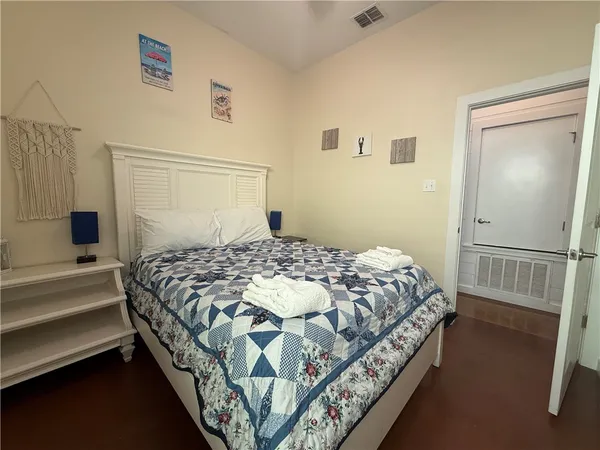 a bedroom with a bed and a walk in closet