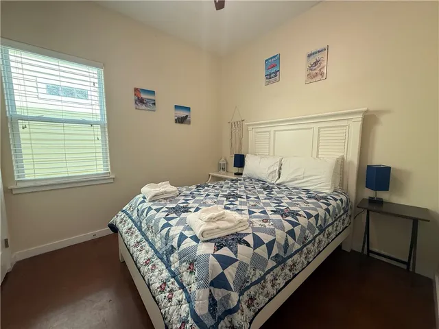 a bedroom with a bed and window