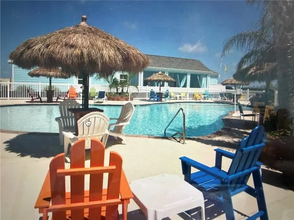 a view of a swimming pool with a patio