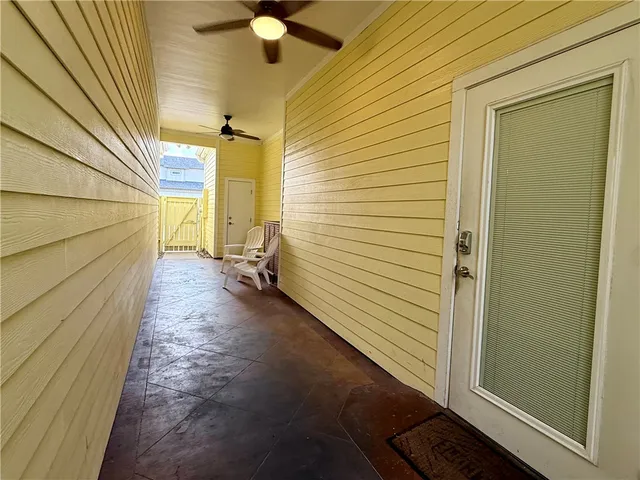 a view of a door and wooden floor