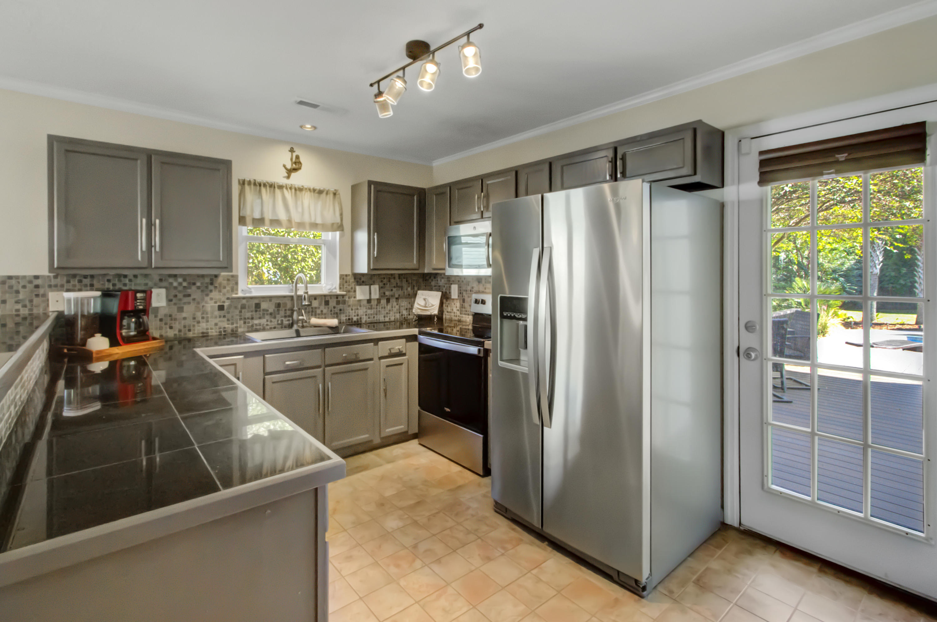 1312 Mapleton Avenue Charleston, SC 29412 - Photo 10 of 21 Stainless Appliances and Tile Backsplash