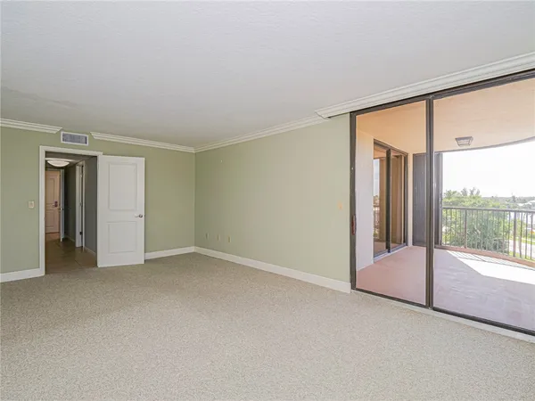 a view of an empty room with a sliding door