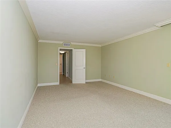a view of an empty room and fire place