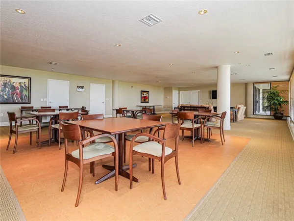 a room with lots of chairs and mirrors