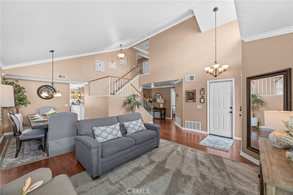 20257 Edmund Road Riverside, CA 92508 - Photo 8 of 53 a living room with furniture a chandelier and a chandelier