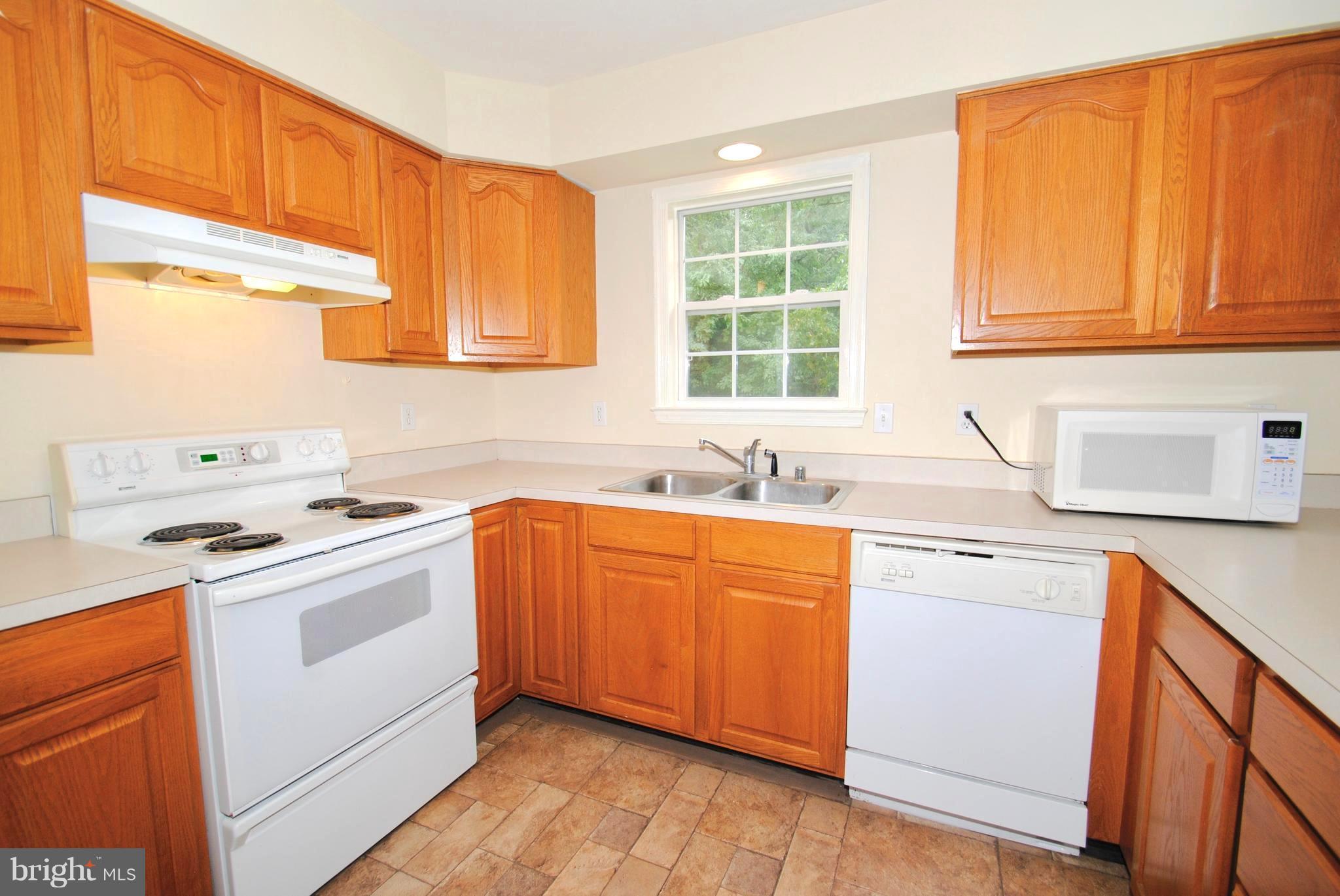 71 Jones Station Road Arnold, MD 21012 - Photo 15 of 26 Wood Cabinetry . Crisp White Appliances