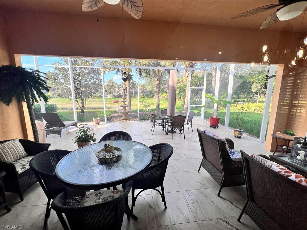 7651 Hernando Court Naples, FL 34114 - Photo 13 of 37 a view of a dining room with furniture window and outside view
