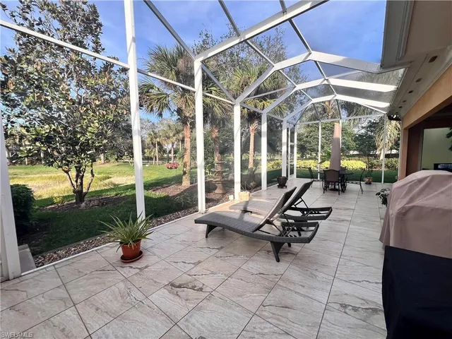 a view of a patio with a table and chairs