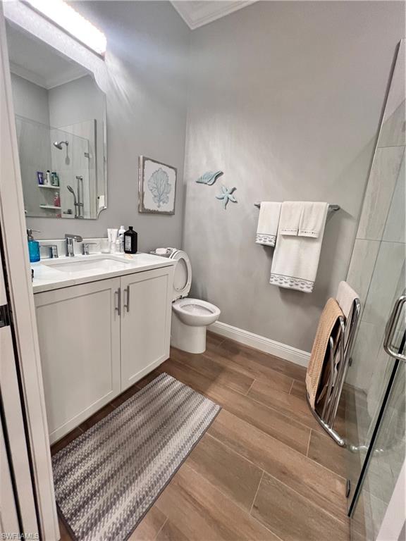 7651 Hernando Court Naples, FL 34114 - Photo 18 of 37 a bathroom with a sink a toilet and mirror