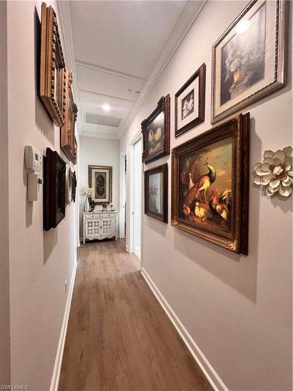7651 Hernando Court Naples, FL 34114 - Photo 24 of 37 a view of a hallway with wooden floor and fireplace
