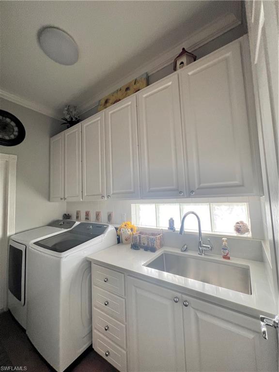 7651 Hernando Court Naples, FL 34114 - Photo 28 of 37 a kitchen with a sink cabinets and window