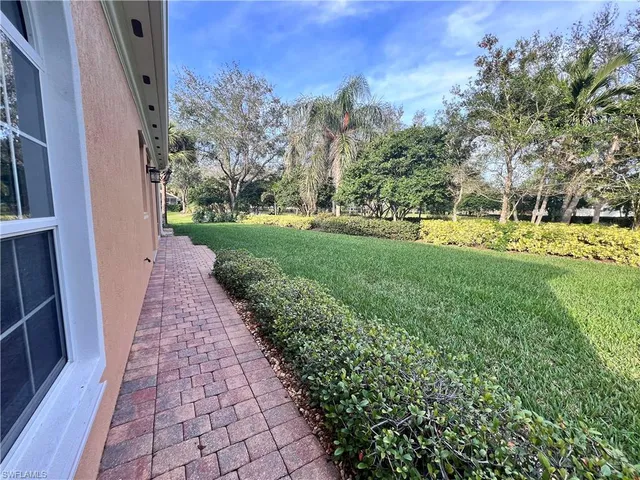 a view of a pathway with a yard